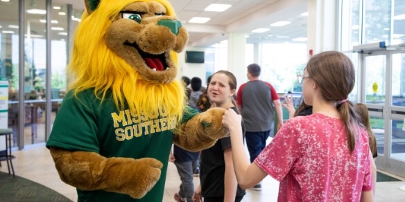 mascot with student
