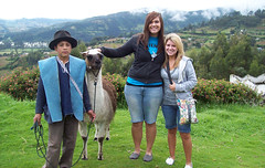 Students standing with a llama in Equador