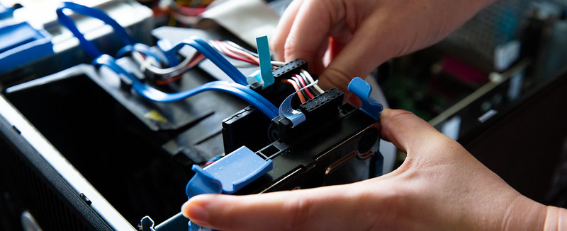 person working on computer parts 