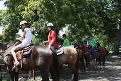 A group of Talent Search students on horses at Sky Ranch.