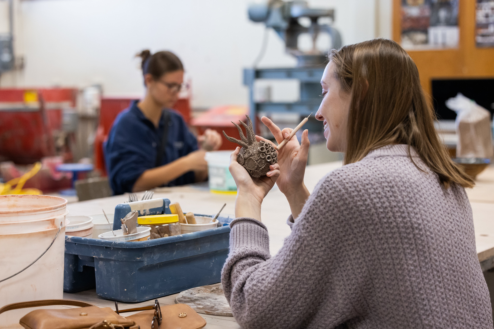 art students working with clay 