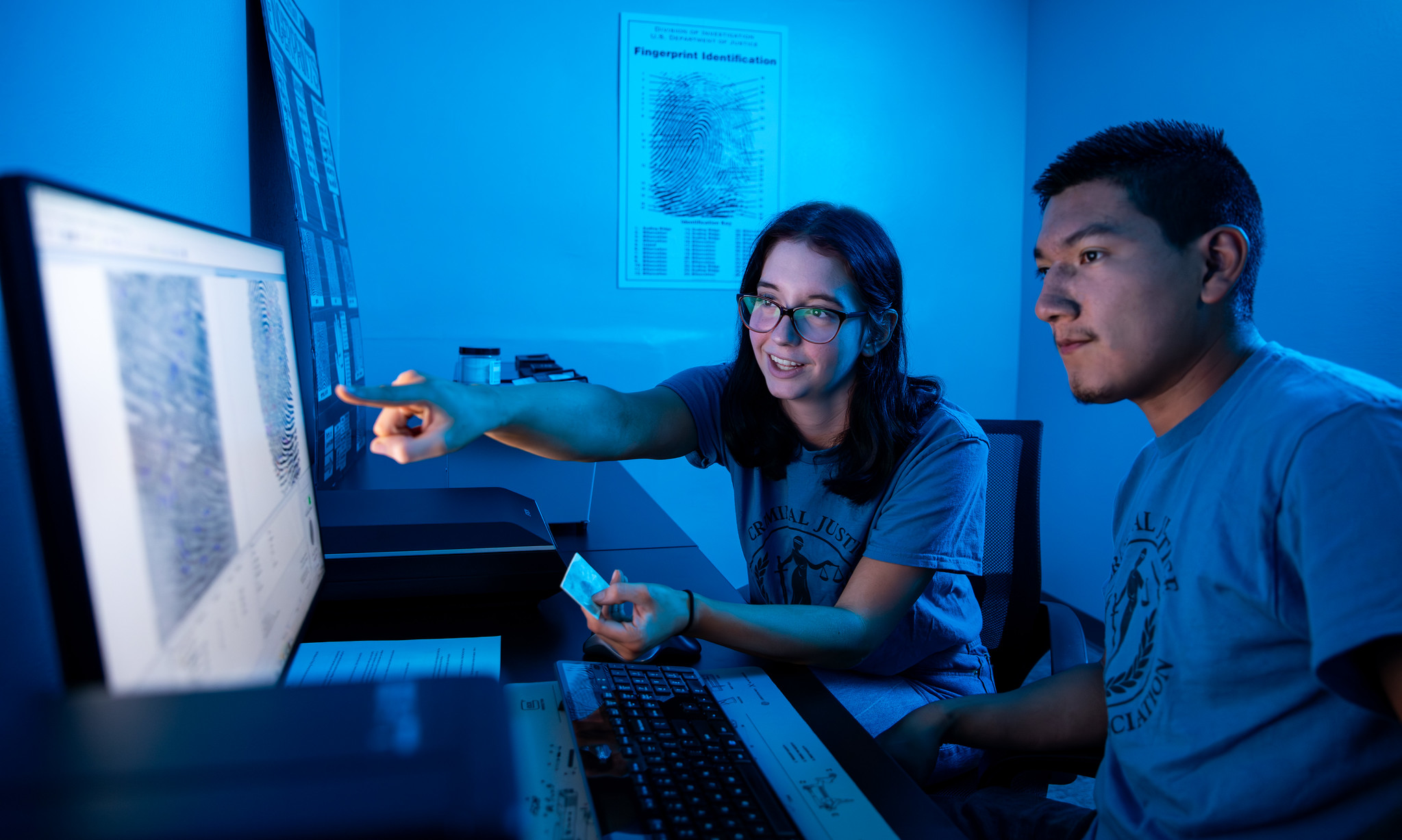 students looking at computer