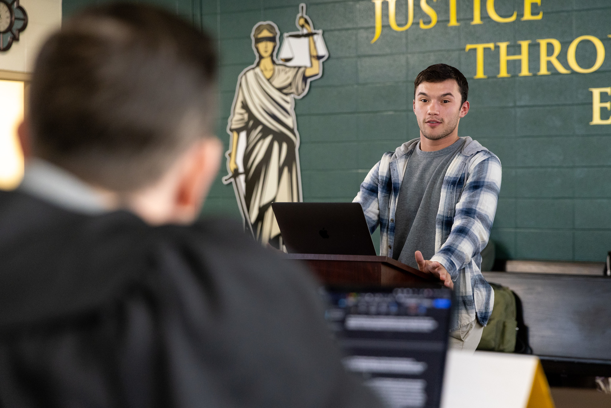 IPA student giving speech at podium