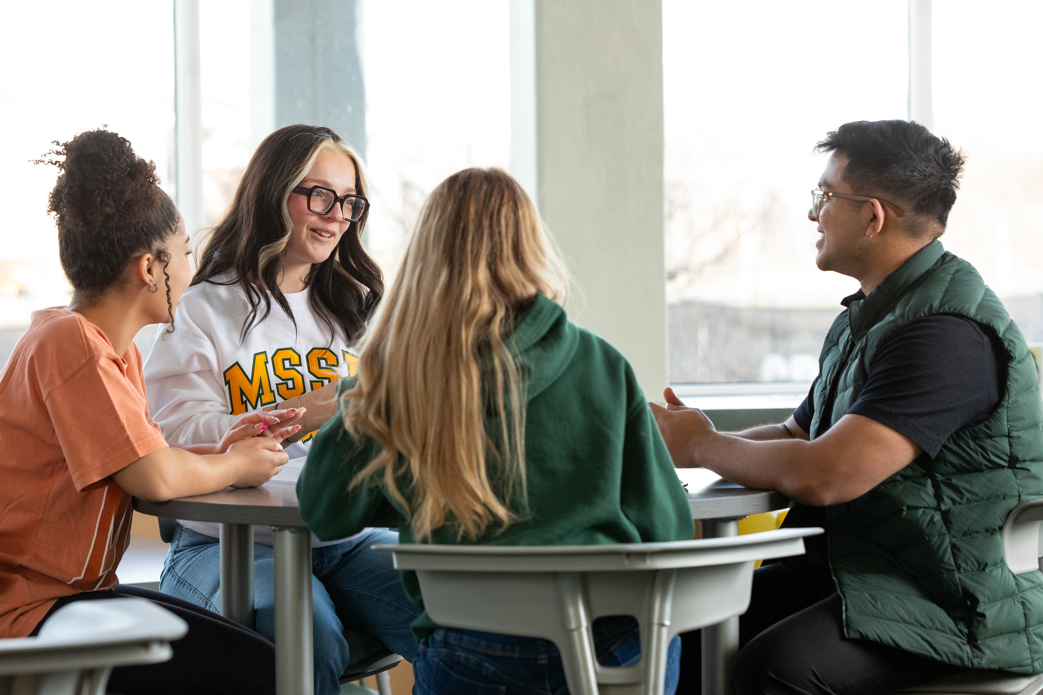 students gathered at a table