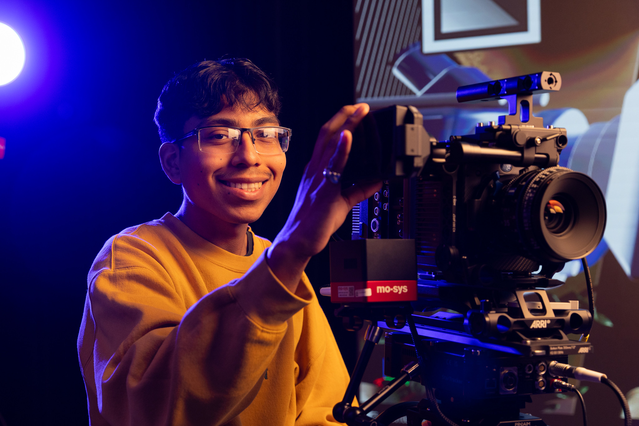 student holding camera