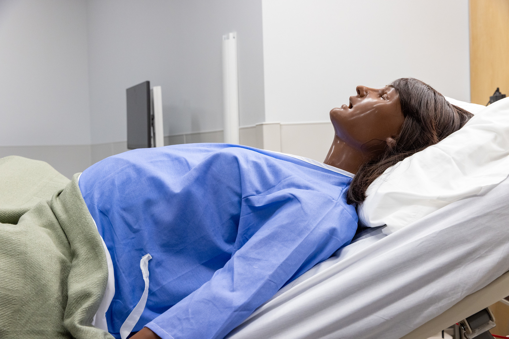 dummy laying in hospital bed