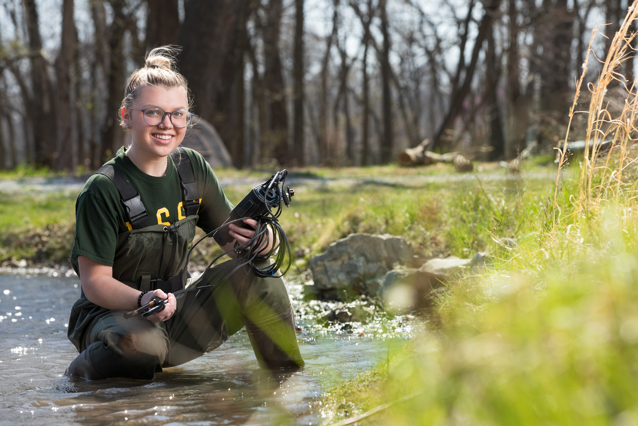 student in pond
