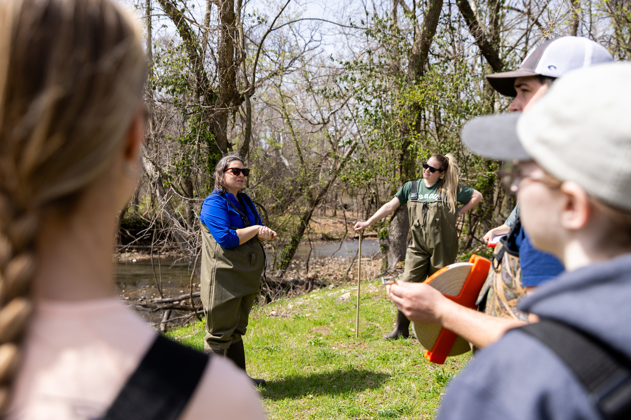 ecology students listening to faculty outside 
