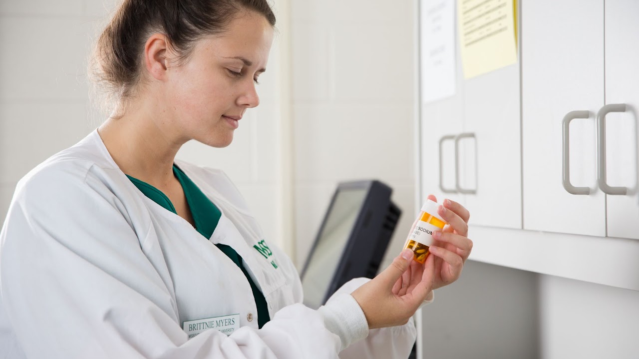 person reading medication 