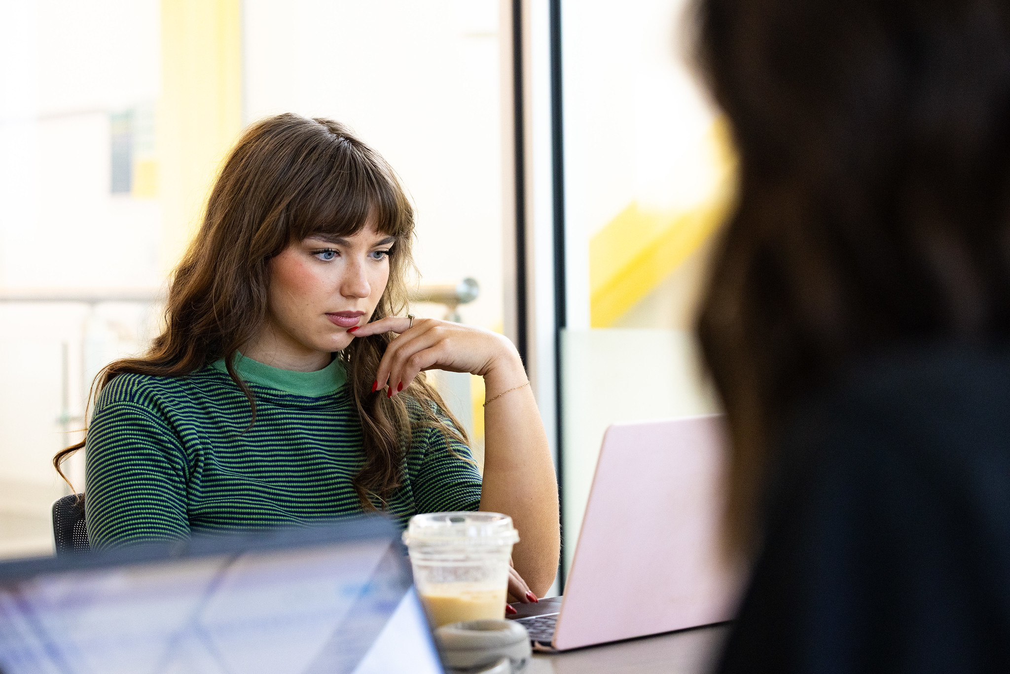 Student typing on laptop 