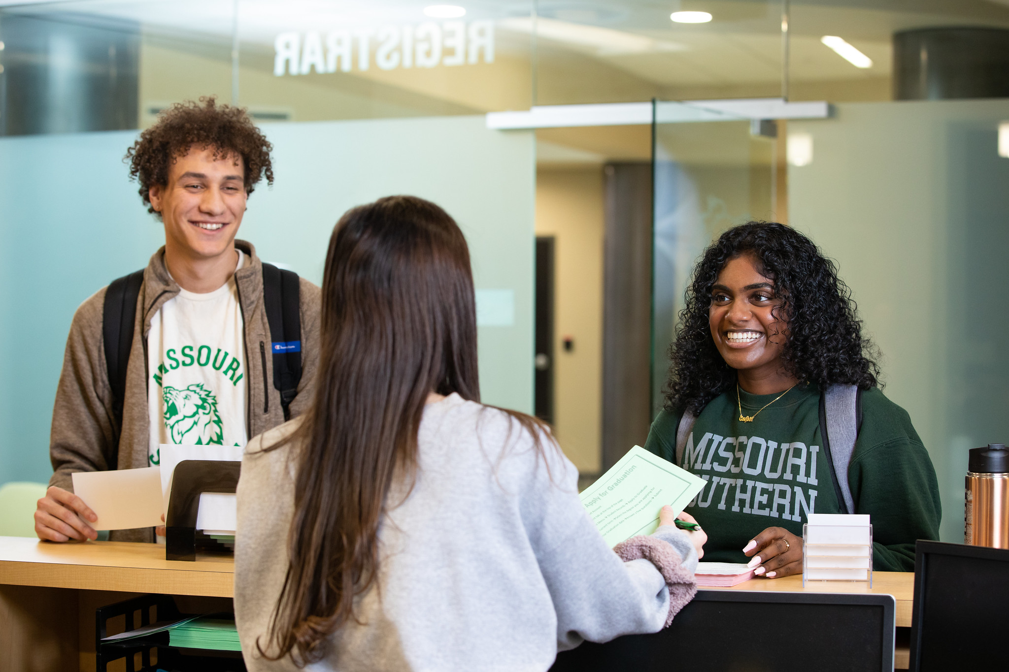 students at register booth 